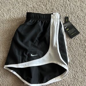 White and Black Nike Shorts.